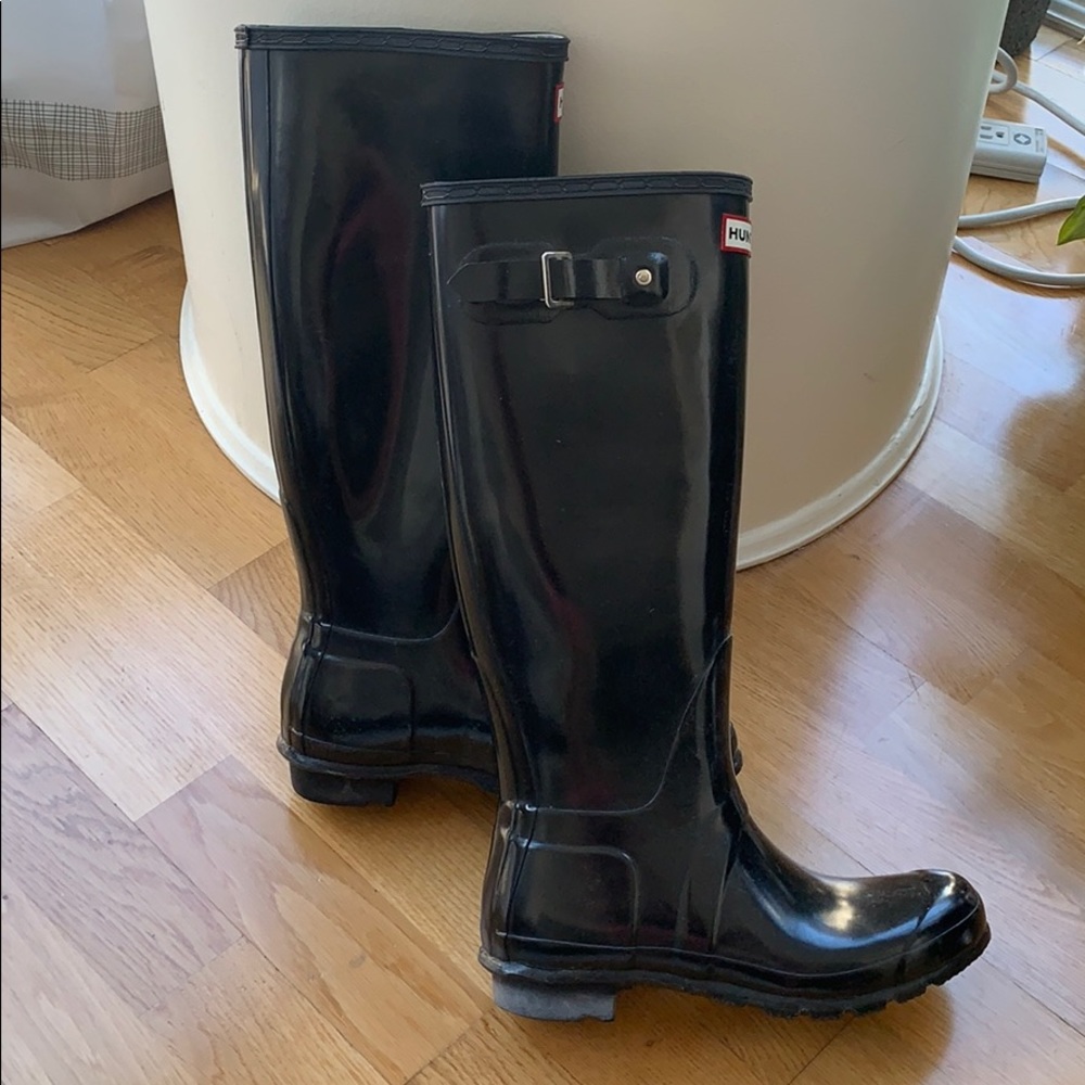 Tall black hunter boots